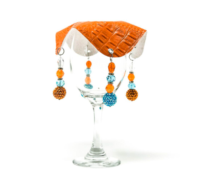 orange drink cover made from vegan leather with beautiful bead work on glass