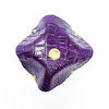 purple crocodile skin textured drink cover with yellow and purple beads on glass from the top view