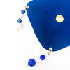 smooth textured, royal blue drink cover modeled off of the glass
