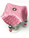 Top of pink vegan leather drink cover with beads and a straw slot