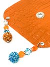 orange drink cover made from vegan leather with beautiful bead work lying flat