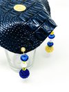 deep, navy blue drink cover with crocodile skin texture from the top view