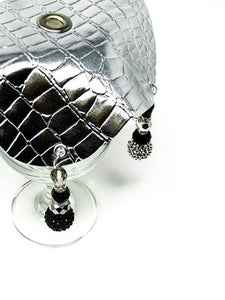 Over the top view of the silver drink cover modeled on a glass
